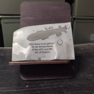 Part of the Russian air-to-surface cruise missile Kh-59M with engraving and stand.