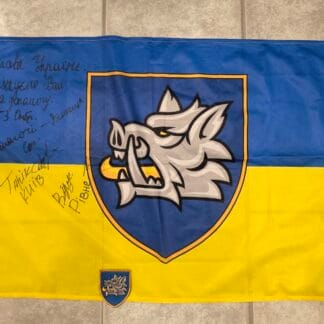 Ukrainian ensign with patch signed by fighters of 214th Special Operations Battalion OPFOR